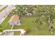 Expansive backyard with lush green lawn and mature trees, bordered by a white privacy fence at 1603 N Park Rd, Plant City, FL 33563