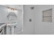 Modern bathroom with tiled shower, vanity, and well-lit mirror, providing a clean and stylish space at 1603 N Park Rd, Plant City, FL 33563