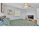 Bedroom with ceiling fan, window and television at 1603 N Park Rd, Plant City, FL 33563