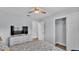 Inviting bedroom with a mounted TV and ample storage provides comfort and functionality at 1603 N Park Rd, Plant City, FL 33563