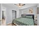 Comfortable bedroom featuring a ceiling fan, closet, and a window for natural light at 1603 N Park Rd, Plant City, FL 33563