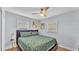 Relaxing bedroom with natural light, soft green bedding, and a side table adding charm and functionality at 1603 N Park Rd, Plant City, FL 33563