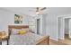 Comfortable bedroom featuring a wood frame bed, closet, side tables, and a ceiling fan at 1603 N Park Rd, Plant City, FL 33563