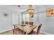 Charming dining area featuring a stylish chandelier, and a wooden table with chairs at 1603 N Park Rd, Plant City, FL 33563