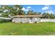 Charming single-story home featuring a well-maintained lawn and inviting front entrance at 1603 N Park Rd, Plant City, FL 33563