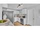 Well-lit kitchen featuring stainless steel appliances, marble countertops and patterned backsplash at 1603 N Park Rd, Plant City, FL 33563
