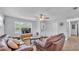 Cozy living room featuring contemporary furniture, natural light, and neutral decor at 1603 N Park Rd, Plant City, FL 33563