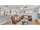Inviting living room with comfortable seating, a ceiling fan, and ample natural light at 1603 N Park Rd, Plant City, FL 33563