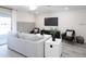 Spacious living room with neutral colors, modern furniture, and lots of natural light at 2750 Walden Town Cir, Plant City, FL 33566