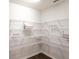 Spacious walk-in pantry with white wire shelving, providing ample storage space for all your culinary needs at 35444 Darlington Grove Dr, Zephyrhills, FL 33541