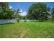 Large backyard space featuring a white privacy fence and ample green space; an outdoor sanctuary at 3611 Maxwell Rd, Plant City, FL 33566