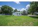 Spacious backyard featuring a trampoline, shed, and a screened-in porch; a peaceful outdoor retreat at 3611 Maxwell Rd, Plant City, FL 33566