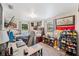 Cozy bedroom featuring a bed, desk, and windows with natural light; a comfortable personal space at 3611 Maxwell Rd, Plant City, FL 33566