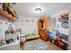 Bright, playful bedroom with shelves, a toy storage unit, and a fun rug at 3611 Maxwell Rd, Plant City, FL 33566