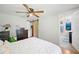 Bedroom boasts a modern ceiling fan, hardwood floors, and a convenient barn door to a walk-in closet at 3611 Maxwell Rd, Plant City, FL 33566