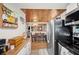 Efficient kitchen with white cabinets, wood accents, and an open layout connecting to the adjacent dining area at 3611 Maxwell Rd, Plant City, FL 33566