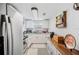 Well-lit kitchen featuring white cabinetry, modern appliances, and ample counter space for culinary enthusiasts at 3611 Maxwell Rd, Plant City, FL 33566