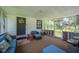 Inviting screened-in porch with comfortable seating, a welcoming entrance, and ample space for relaxation at 3611 Maxwell Rd, Plant City, FL 33566