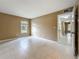 Neutral bedroom with tile flooring and ample natural light from the window at 4022 Tumble Wood Trl # 101, Tampa, FL 33613