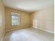 This bedroom has tile flooring and a window with a view of the outdoors at 4022 Tumble Wood Trl # 101, Tampa, FL 33613