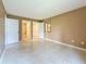 Neutral bedroom with tile flooring and walk-in closet and ensuite bath at 4022 Tumble Wood Trl # 101, Tampa, FL 33613