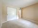 A bedroom with tile flooring, neutral walls, closet and window, door leading out at 4022 Tumble Wood Trl # 101, Tampa, FL 33613
