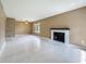 Bright living room featuring tile floors, a fireplace, a ceiling fan, and large windows at 4022 Tumble Wood Trl # 101, Tampa, FL 33613