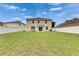 Large, grassy backyard enclosed by a white fence, offering privacy and space for recreation at 503 Arbequina Ct, Plant City, FL 33566