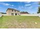 Expansive backyard featuring a lush lawn and secure white fence, ideal for families and pets at 503 Arbequina Ct, Plant City, FL 33566