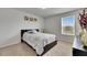 Cozy bedroom featuring plush carpet, a window offering natural light, and a comfortable bed with a stylish quilt at 503 Arbequina Ct, Plant City, FL 33566