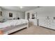 A well lit bedroom featuring neutral carpet and white walls with plentiful drawer space at 503 Arbequina Ct, Plant City, FL 33566