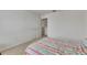 Clean bedroom space with neutral carpet, a double-door closet, and a comfortable bed at 503 Arbequina Ct, Plant City, FL 33566