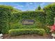 Alterra neighborhood entrance sign surrounded by lush greenery and manicured hedges at 503 Arbequina Ct, Plant City, FL 33566