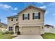 Charming exterior view of a two-story home with a well-maintained lawn at 503 Arbequina Ct, Plant City, FL 33566