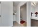 Cozy half bath with tiled floors, a small shelf with towels, and an elongated toilet at 503 Arbequina Ct, Plant City, FL 33566