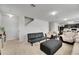 Open living area showing staircase and open floor plan with modern decor and furnishings at 503 Arbequina Ct, Plant City, FL 33566