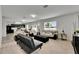 Spacious living area with a kitchen, dining table, and a comfortable seating arrangement at 503 Arbequina Ct, Plant City, FL 33566