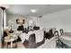Comfortable living area with a mix of seating options, a TV, and an adjacent staircase at 503 Arbequina Ct, Plant City, FL 33566