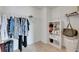 Functional walk-in closet with ample shelving and hanging space for clothing and storage at 503 Arbequina Ct, Plant City, FL 33566