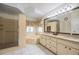 Bright bathroom showcasing a soaking tub and walk-in shower at 2024 E Del Webb Blvd, Sun City Center, FL 33573