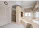 Well-lit bathroom featuring a soaking tub and separate shower at 2024 E Del Webb Blvd, Sun City Center, FL 33573