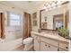 Bathroom featuring a single vanity with granite countertop and tub/shower combination at 2024 E Del Webb Blvd, Sun City Center, FL 33573