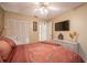 Bedroom with a closet, flat screen TV and overhead lighting at 2024 E Del Webb Blvd, Sun City Center, FL 33573