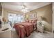 Comfortable bedroom with large windows and cozy decor at 2024 E Del Webb Blvd, Sun City Center, FL 33573
