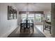 Elegant dining room featuring a dark wood table with seating for six beneath a stylish chandelier at 2024 E Del Webb Blvd, Sun City Center, FL 33573