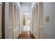 Hallway with closet space leading to ensuite bathroom at 2024 E Del Webb Blvd, Sun City Center, FL 33573