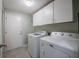 Well-organized laundry room with modern washer and dryer at 2024 E Del Webb Blvd, Sun City Center, FL 33573