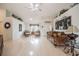Bright living room with high ceilings, light wood floors, and a decorative chandelier at 2024 E Del Webb Blvd, Sun City Center, FL 33573