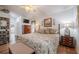 Comfortable main bedroom with wood floors, closet, and ensuite bathroom at 2024 E Del Webb Blvd, Sun City Center, FL 33573