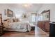 Spacious main bedroom featuring wood floors and ample furniture at 2024 E Del Webb Blvd, Sun City Center, FL 33573